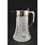 A heavy cut glass lemonade jug with silver plated mounts, removable ice compartment, maker John