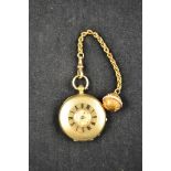 An 18ct gold cased ladies fob watch, engraved decoration to dial, interior engraved A B Barnad, 58