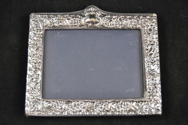 A Victorian style embossed silver mounted photograph frame, to take 9x13cm photograph, maker Keyford