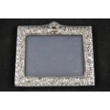 A Victorian style embossed silver mounted photograph frame, to take 9x13cm photograph, maker Keyford