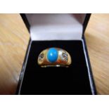 An 18ct gold ring set with oval cabouchon turquoise and two diamonds, size L - approx gross weight