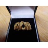 An 18ct gold ring with abstract pierced design, size Q - approx weight 8.5g. CONDITION REPORT good