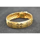 An 18ct gold articulated bracelet with geometric 'diamond' design - approx weight 40.5g. CONDITION