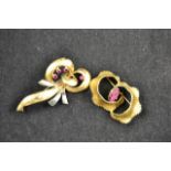 An 18ct yellow and white gold brooch of stylised bow design, set with four rubies - approx gross