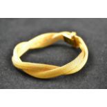 An 18ct gold entwined mesh bracelet - approx weight 23g. CONDITION REPORT good condition