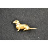 A 1960's 18ct gold dachshund brooch, diamond set collar and ruby eye, stamped BR Ltd - length 4.