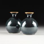 A PAIR OF DIMINUTIVE CHINESE IRIDESCENT DARK BLUE GLAZED PORCELAIN VASES, MODERN, each of globular