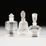A GROUP OF THREE FROSTED AND CLEAR MOLDED GLASS PERFUME BOTTLES, 20TH CENTURY, one modeled as a