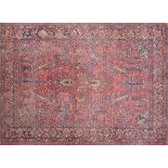 A SAROUK CARPET, the Persian rose field centering a double pendant medallion within a surround of