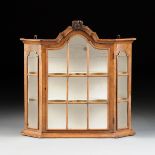 A DUTCH BAROQUE STYLE CARVED WALNUT HANGING WALL CABINET, LATE 19TH CENTURY, with an arched