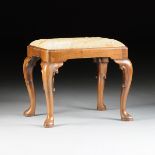 A QUEEN ANNE STYLE CARVED WALNUT STOOL, 19TH CENTURY, with a rectangular polychrome blossoming