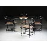 A CONTEMPORARY GLASS TOPPED STAINLESS STEEL AND GRANITE DINING TABLE WITH FOUR CHINESE STYLE BLACK