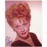 A LUCILLE BALL AUTOGRAPHED 8' X 10' COLOR PHOTOGRAPH, a formal portrait of Lucille Ball dating to