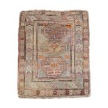 A SMALL VINTAGE CAUCASIAN PRAYER RUG, with a pale bluish field centering octagonal shields of