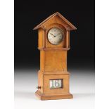 A THOMAS ERNST HALLER AG MINIATURE PORTABLE ALARM CLOCK AND MANTLE DISPLAY CASE, GERMAN, CIRCA 1910,