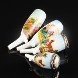 A GROUP OF FOUR GERMAN POLYCHROME DECORATED PORCELAIN PIPES, LATE 19TH/EARLY 20TH CENTURY, of