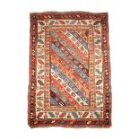 A SEMI ANTIQUE PERSIAN BRICK RED FIELD PRAYER RUG, with dark brown, blue, green and neutral