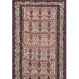 A SEMI ANTIQUE PERSIAN RUNNER, CIRCA 1960, the ivory ground wool on cotton foundation runner with