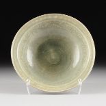 AN ANTIQUE CHINESE CELADON GLAZED SERVING BOWL, 19TH CENTURY, the rounded rim on a sloped border