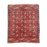 A VINTAGE PERSIAN RED FIELD PRAYER RUG, centering rows of dark blue, neutral and pink shaped