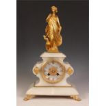 A stylish late 19th Century French Onyx and Gilt Bronze MANTEL CLOCK the shaped case with skirted