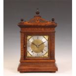 A late 19th Century Winterhalder & Hofmeier carved Oak MANTEL CLOCK with architectural pediment