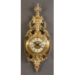 A good late 19th Century French ornate cast brass CARTEL CLOCK  the cream porcelain dial with