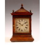 A late 19th Century carved Oak MANTEL CLOCK with sloping pediment and silvered sheet brass Roman