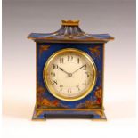 An Edwardian Chinoisserie decorated blue Lacquer pagoda top MANTLE CLOCK with cream Arabic convex