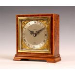 A 1950’s Elliott boxwood strung Amboyna MANTLE CLOCK with gilt and silvered dial, eight day spring