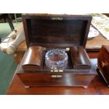 Georgian Rosewood sarcophagus shaped 2 division tea caddy standing on 4 squat bun feet, with solid