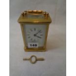 20thC Brass Carriage Clock with Roman Numeral dial and twin end key, Height 11cm Condition – Good