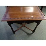 Oak Rectangular side table with carved top, foliate decorated sides and cruciform turned supports,