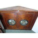 Georgian Walnut Corner cabinet with quartered veneer doors, inset roundel prints of classical