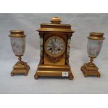 A French Sevres style porcelain and gilt metal mantel clock garniture, the eight-day bell striking