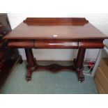 William IV Mahogany hall table with single drawer, waisted support supported on scroll caster