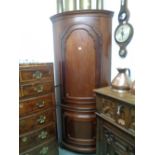 Large Mahogany Corner cabinet with carved panel door supported on bracket feet, Height 203cm