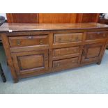 18thC Elm Sideboard of 3 drawers above 2 with cupboard sides of panel construction reputedly from