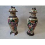 Pair of 19thC Chinese Famille Rose Crackle Glaze vases with Dog of Foe surmounted lids, decorated