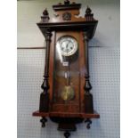 Jughans Walnut cased wall clock with turned and fluted decoration, 90cm in Length Condition - Good