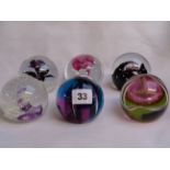Collection of 6 Caithness glass paperweights Inc. 'Vortex', 'Scimitar', 'Sparkle', 'Night