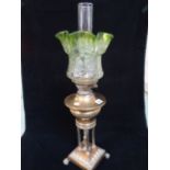 19thC Ornate Oil Lamp with column supports over paw feet with clear and glass frilled shade, 71cm in