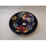 Moorcroft Orchid Pattern Fruit Bowl with Dark Blue Ground, signed and impressed marks to base,