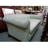 Upholstered Victorian 2 seater green sofa on oak carved square legs on casters