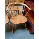 Ercol Light Elm rocking chair with curved stick back and shaped seat