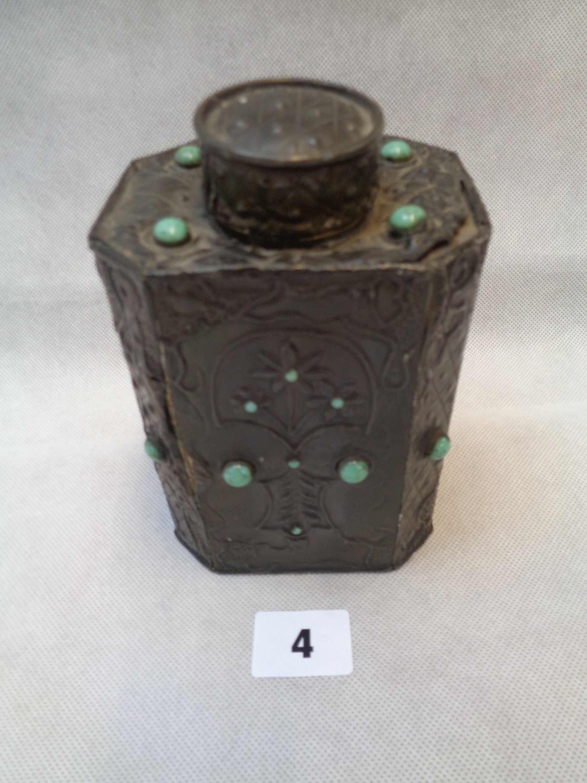 Arts & Crafts Tin Overlay Tea Caddy of Octagonal form with raised floral decoration set with