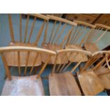 Set of Seven Ercol light Elm stick back dining chairs with splayed legs