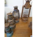 Graduated set of 4 Storm lamps Inc. Tropic Chalwyn and others, Condition - Some rusting