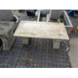 Marble topped garden bench with concrete bench supports
