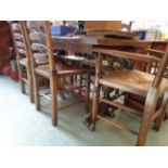 Oak Refectory table with carved bulbous supports and a set of 6 Elm ladder back chairs with rush